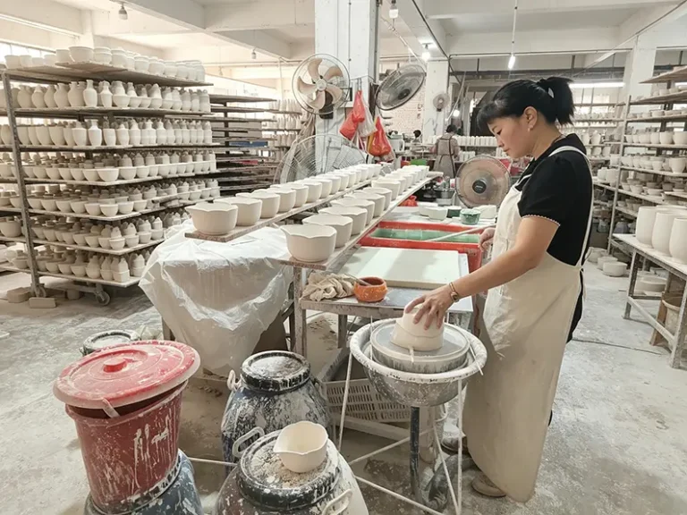 Professional ceramic glazing process at TYY china factory, applying even liquid glaze coating before kiln firing
