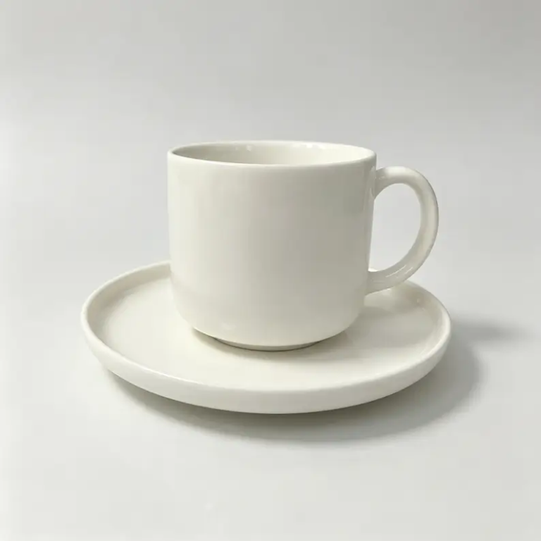 054g White straight-form ceramic coffee cup and saucer with a simple cylindrical profile.