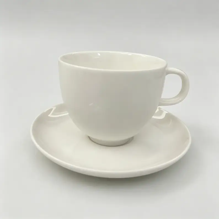 055g White rounded ceramic coffee cup and saucer with a wider cup profile.