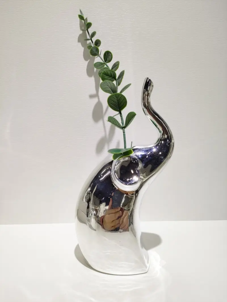 065D standing elephant ceramic decorative figurine featuring an electroplated silver finish and elegant silhouette