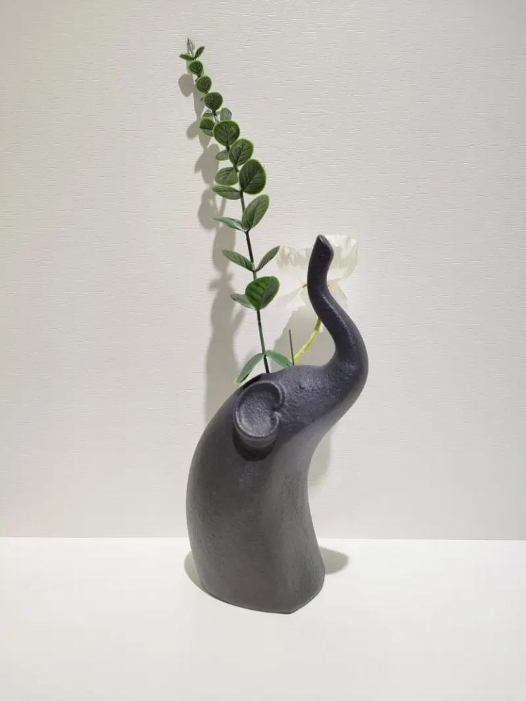065D standing elephant ceramic decorative figurine with matte black surface finish and modern sculptural style