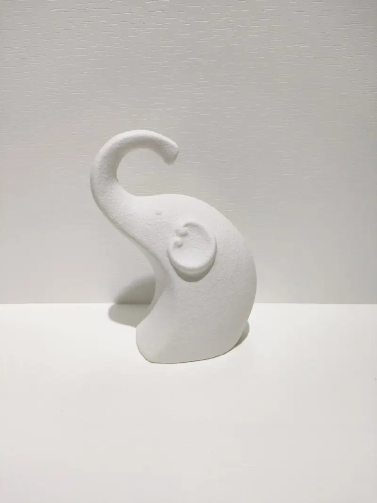 066D curved elephant ceramic decorative figurine with matte white texture and minimalist sculptural design