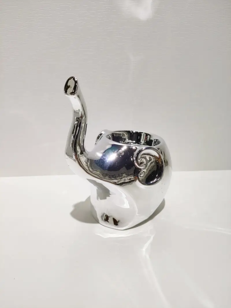 068D sitting elephant ceramic decorative figurine with electroplated silver finish and compact sculptural form