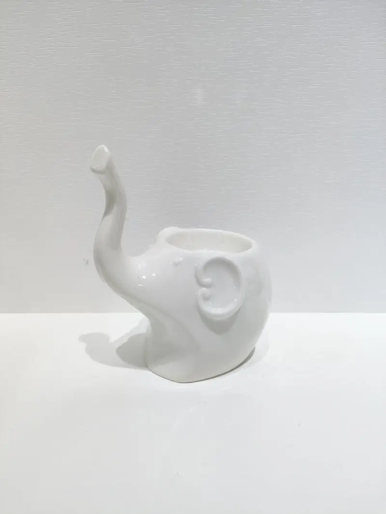068D sitting elephant ceramic decorative figurine with glossy white surface effect and smooth ceramic appearance