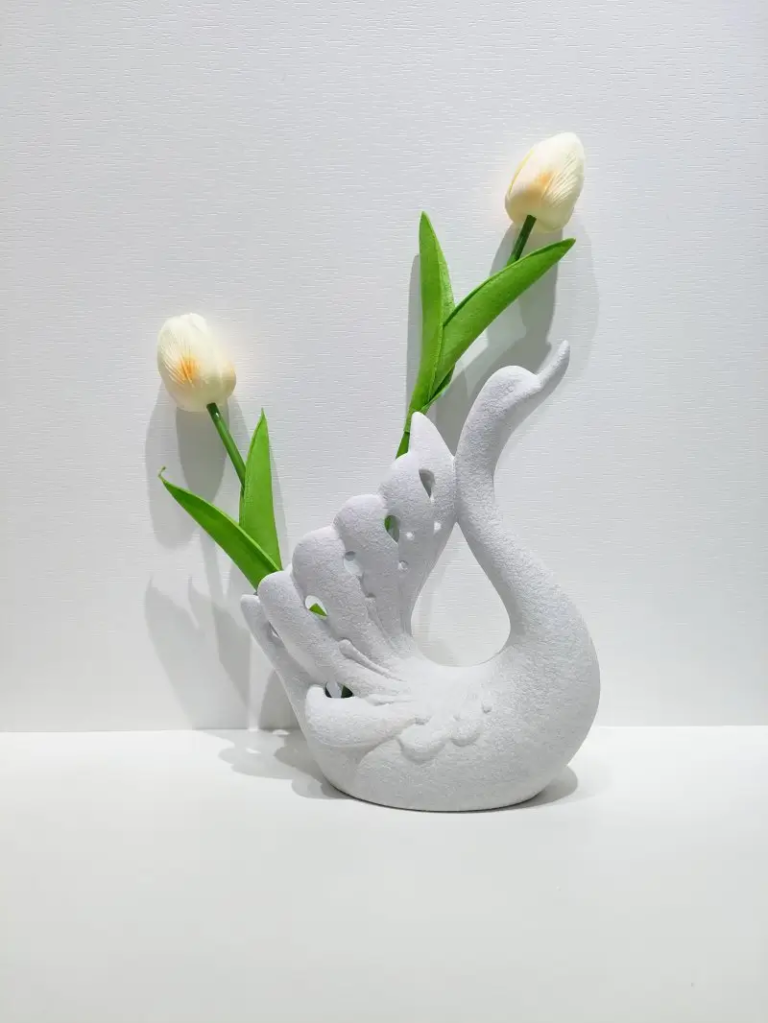 119D Textured Swan Floral Holder featuring open wing design with flower arrangement display.