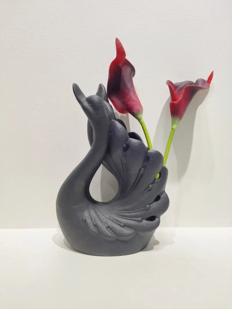 120D Swan Floral Holder in textured matte black finish with curved neck design for flower display.