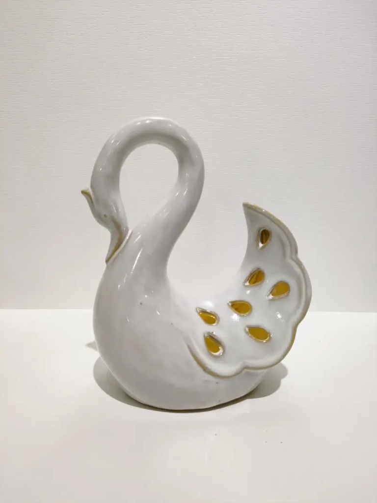 122D Swan Ceramic Form featuring open wing cutout pattern and elegant sculptural design.