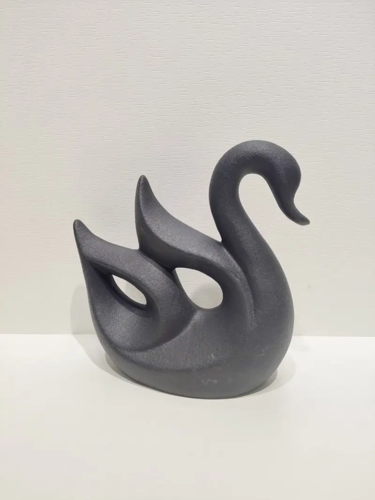 126D Swan Ceramic Form in textured matte black finish with modern minimalist shape.