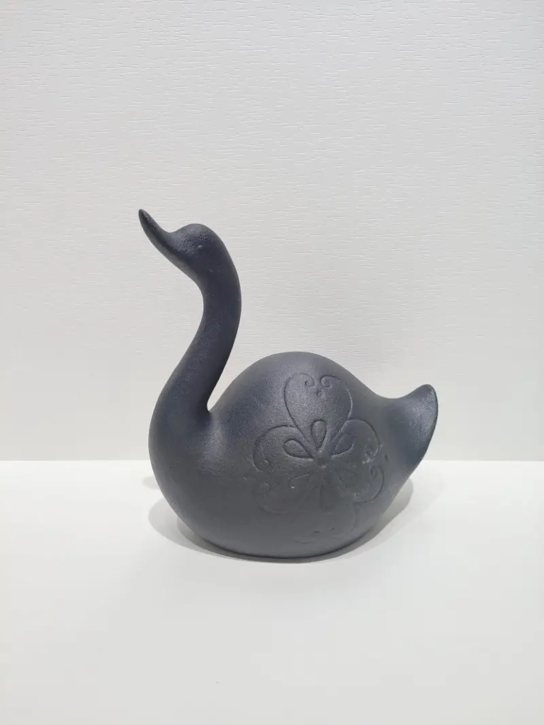 127D Swan Ceramic Form in textured matte black finish with embossed heart pattern detail.