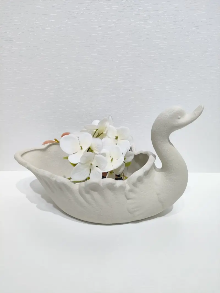 128D Swan Shaped Ceramic Storage Bowl in textured matte white finish with flower display application.
