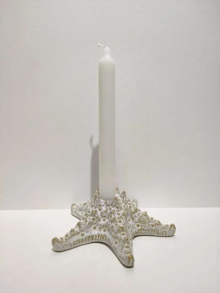 152D starfish ceramic candle holder featuring ocean inspired texture and sculptural design, creating an elegant decorative lighting accent.