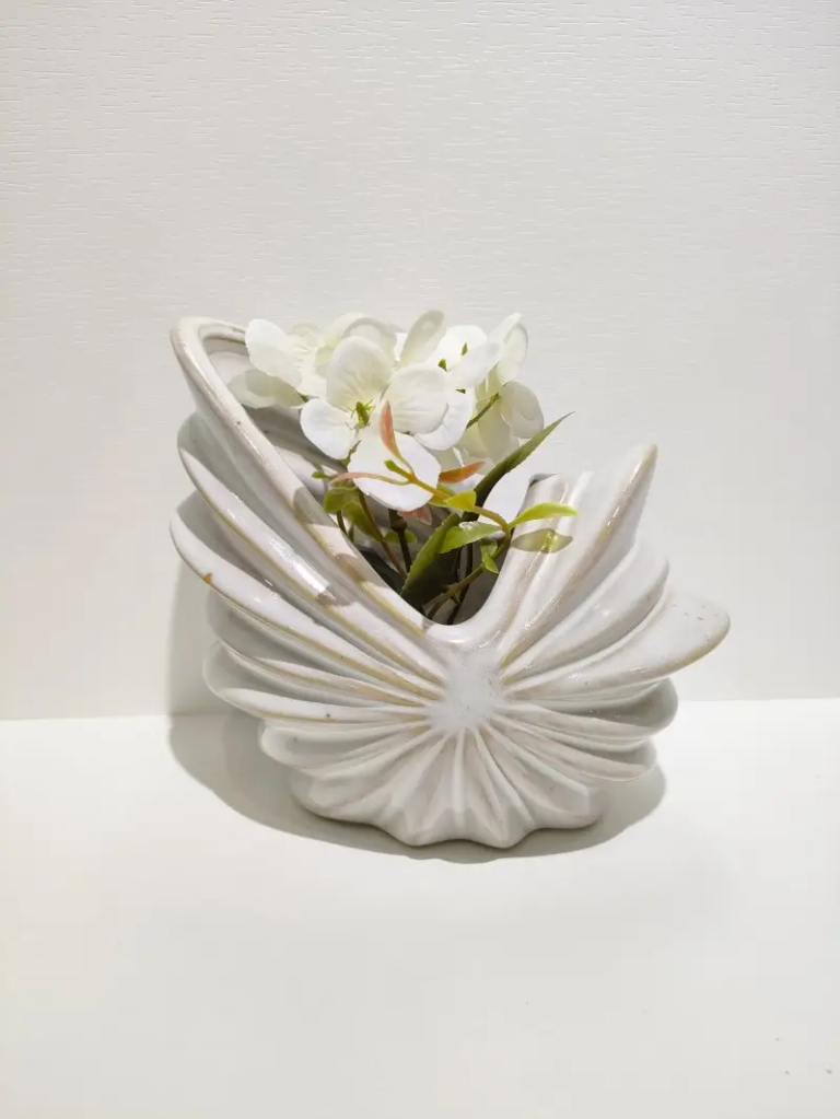 154D shell shaped ceramic storage box with sculptural ocean inspired form, suitable for floral display and modern interior styling.