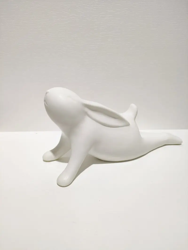 173D white ceramic stretching rabbit sculpture with extended yoga pose, matte finish minimalist decor
