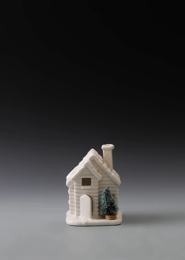 213A twin pine cottage in matte white ceramic with two pine tree details and illuminated windows for holiday displays