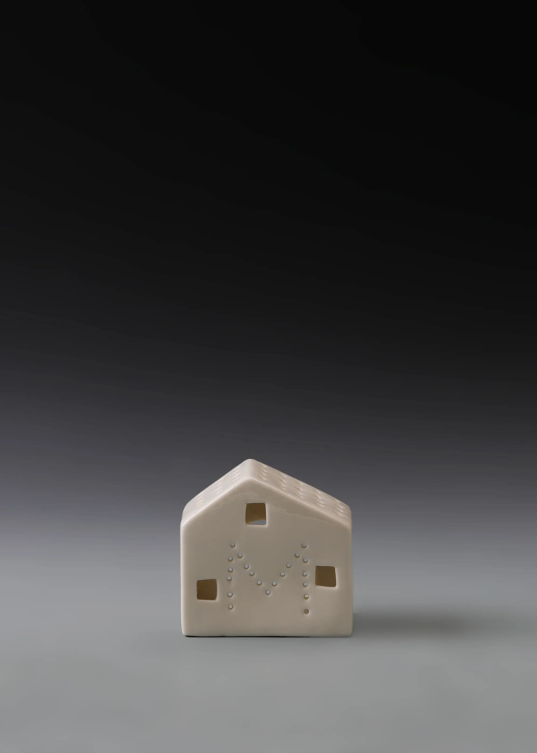 224A simple gable house in matte white ceramic with a low profile and illuminated openings for Christmas village displays