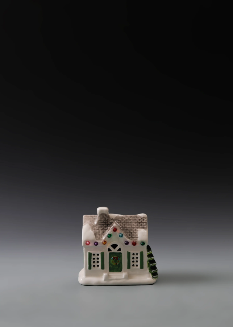 226A holiday shop house in hand-painted multicolor ceramic with a festive storefront design and illuminated openings
