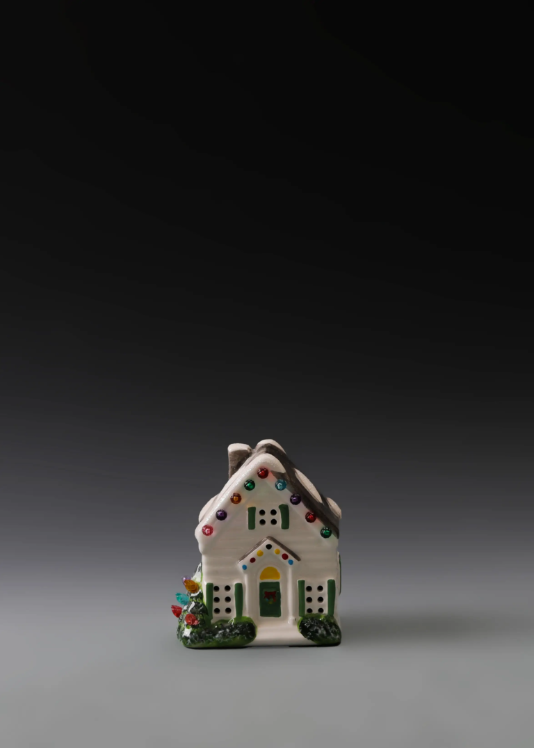 227A colorful gable cottage in hand-painted multicolor ceramic with festive accents and illuminated openings