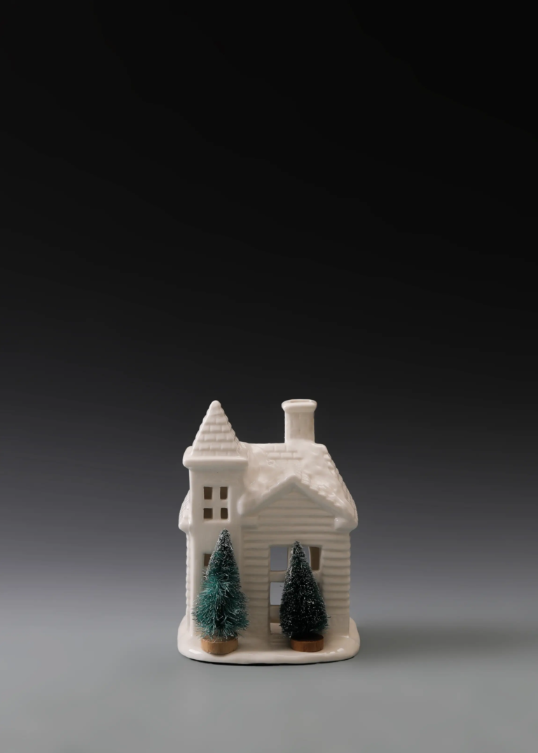 233A twin pine snow house in matte white ceramic with pine tree details, snowy roof and illuminated windows