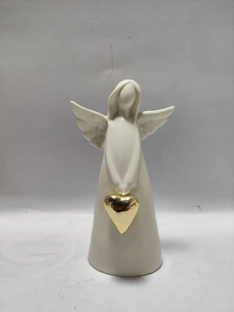 243D glossy white ceramic angel figurine with a gold heart detail and sculptural silhouette for Christmas display.