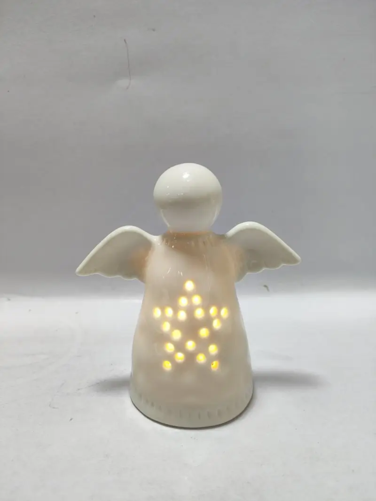 245D white ceramic angel figurine with decorative perforated body details for Christmas and seasonal display.