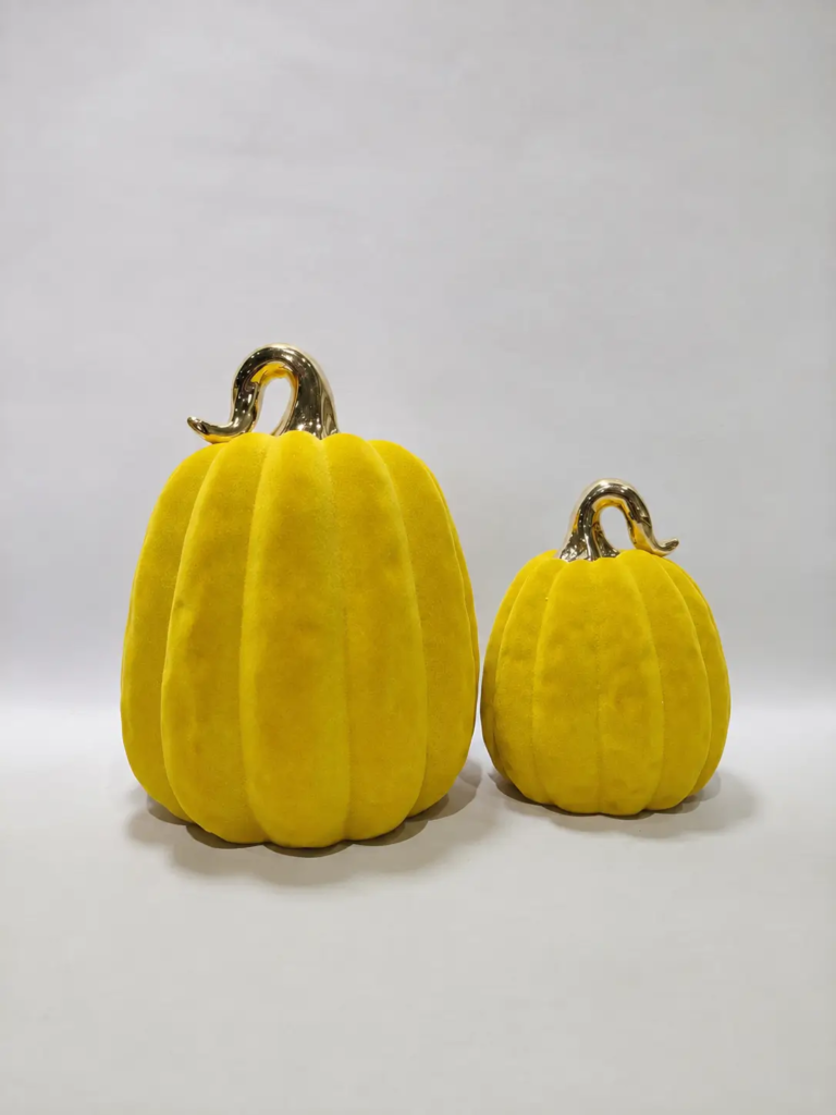 250D yellow flocked pumpkin decorative figurine with an electroplated stem for Halloween seasonal decoration.