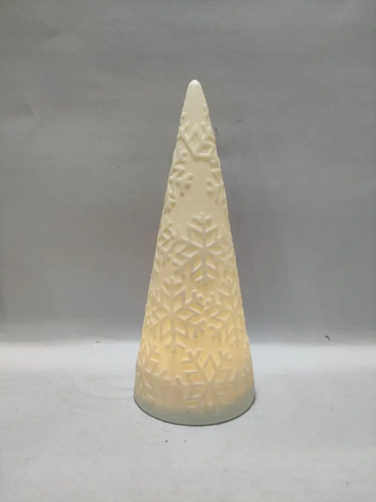 290D Illuminated White Snowflake Cutout Christmas Tree featuring snowflake cutout details, white glazed ceramic and warm built-in lighting for Christmas tabletop displays.