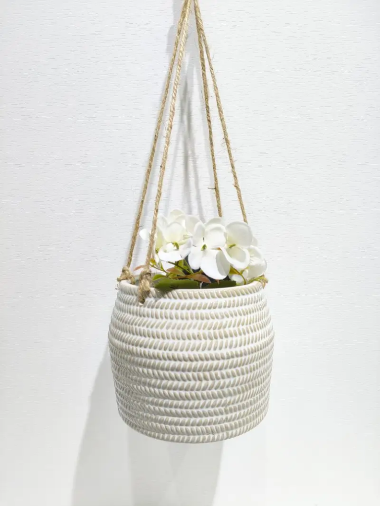 359D reactive white ceramic hanging planter with textured surface design, adding handcrafted style to plant displays.