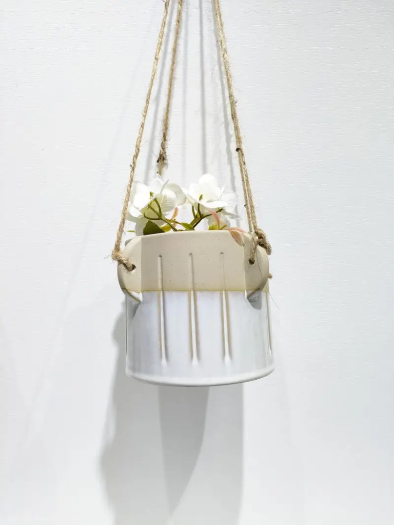 360D two tone cream white ceramic hanging planter combining soft glaze tones and modern form for stylish plant arrangements.