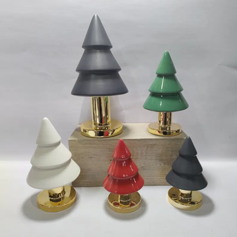 TYY2503 illuminated Christmas tree figurines showing warm light effects through ceramic designs for seasonal atmosphere decoration.