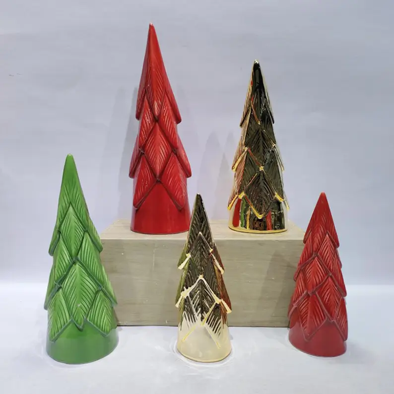 TYY2503 ceramic Christmas tree figurines arranged in different shapes and finishes for coordinated holiday display settings.