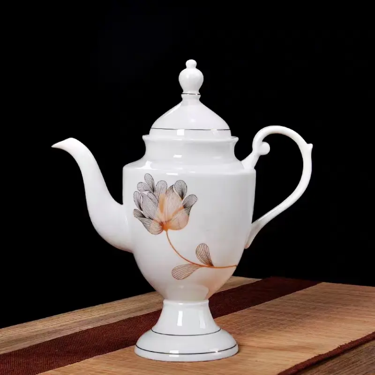 047J European-style porcelain teapot with floral decal decoration and refined gold-trimmed detailing.