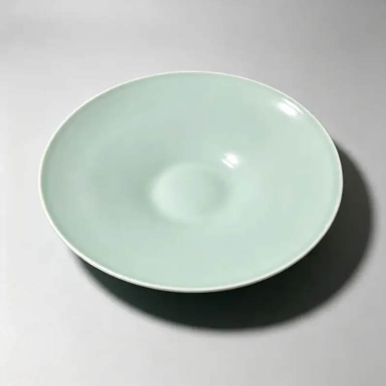 Aqua 10-inch coupe ceramic plate with a glossy glazed surface