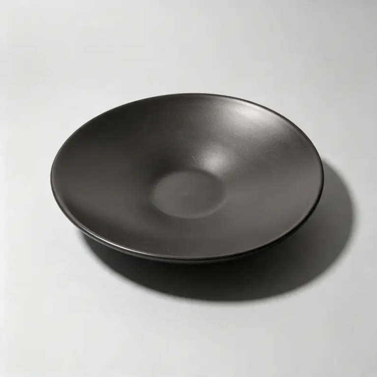 Black coupe ceramic plate available in 12-inch, 10-inch and 7.5-inch sizes