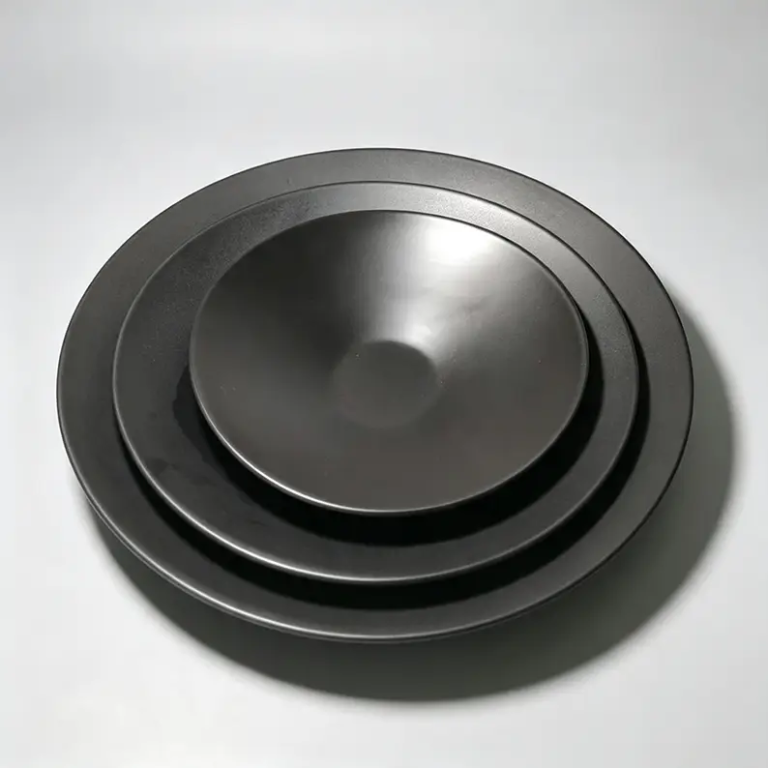 Black coupe ceramic plates in 12-inch, 10-inch and 7.5-inch sizes