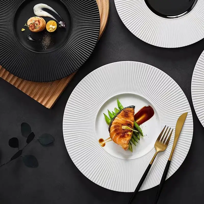 Black, white and black and white fluted ceramic plates with dense radial texture
