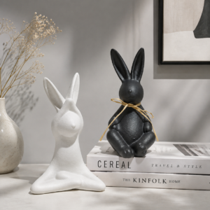 Black and white matte ceramic rabbit figurines with refined surface texture, highlighting minimalist design, artistic details, and contemporary decorative appeal.