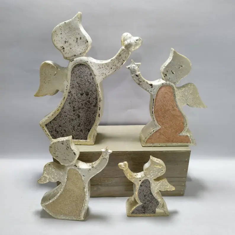 Ceramic angel figurines with curved sculptural silhouettes, raised arms and textured surface finishes