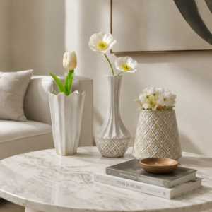 Contemporary home interior featuring multiple ceramic vases with flowers for elegant decorative styling
