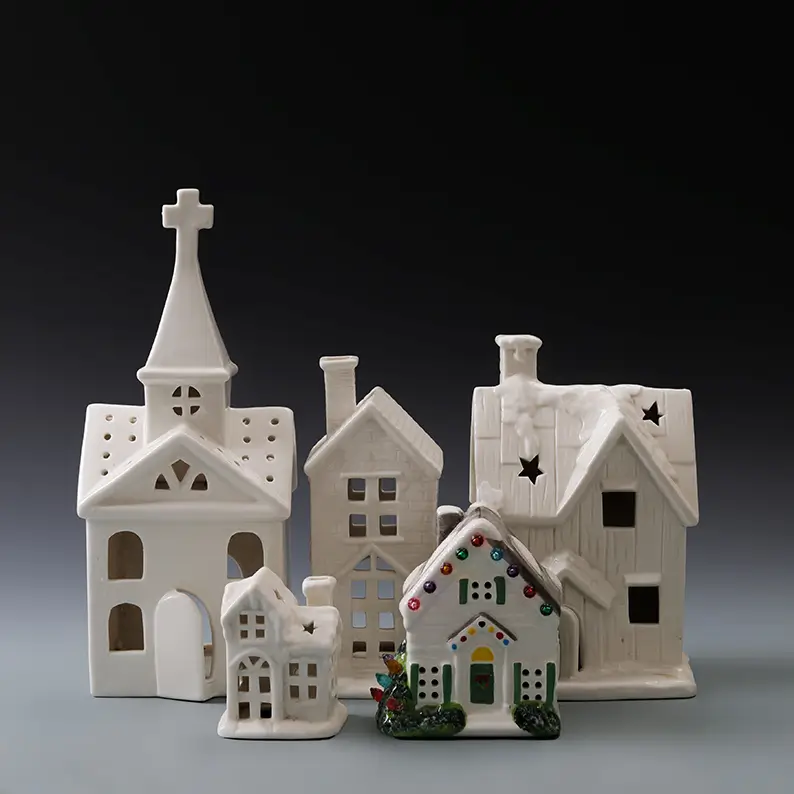 Ceramic Christmas village collection featuring illuminated houses in white and multicolor designs for seasonal holiday displays