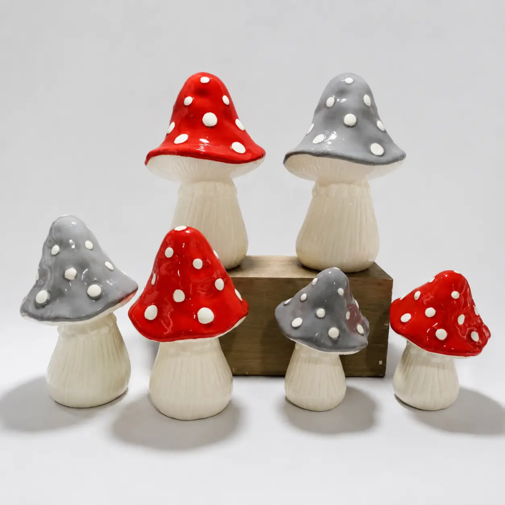 Ceramic mushroom sculptures with handcrafted painted details and unique decorative forms, creating artistic accents for contemporary spaces.