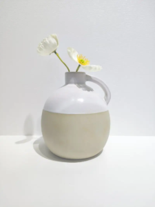 016D Rounded ceramic vase featuring two-tone reactive glaze effect created through high temperature firing