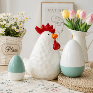 Easter ceramic pieces featuring colorful painted details on the chicken designs, highlighting the decorative painting craftsmanship.