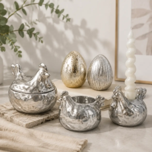 Easter ceramic display featuring raised surface textures with gold and silver electroplated egg finishes, highlighting varied tactile and metallic effects.