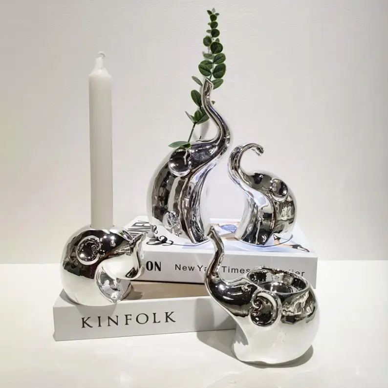 Elephant ceramic decorative figurines styled in a modern interior setting as artistic home decor accents