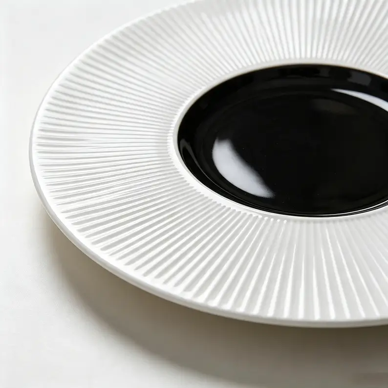 Close-up of dense radial fluted texture on a ceramic plate surface