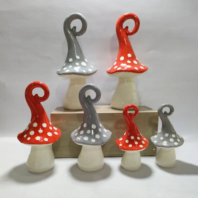 Glossy glazed ceramic mushroom decoration showcasing smooth ceramic texture, handcrafted painted patterns, and refined decorative details.