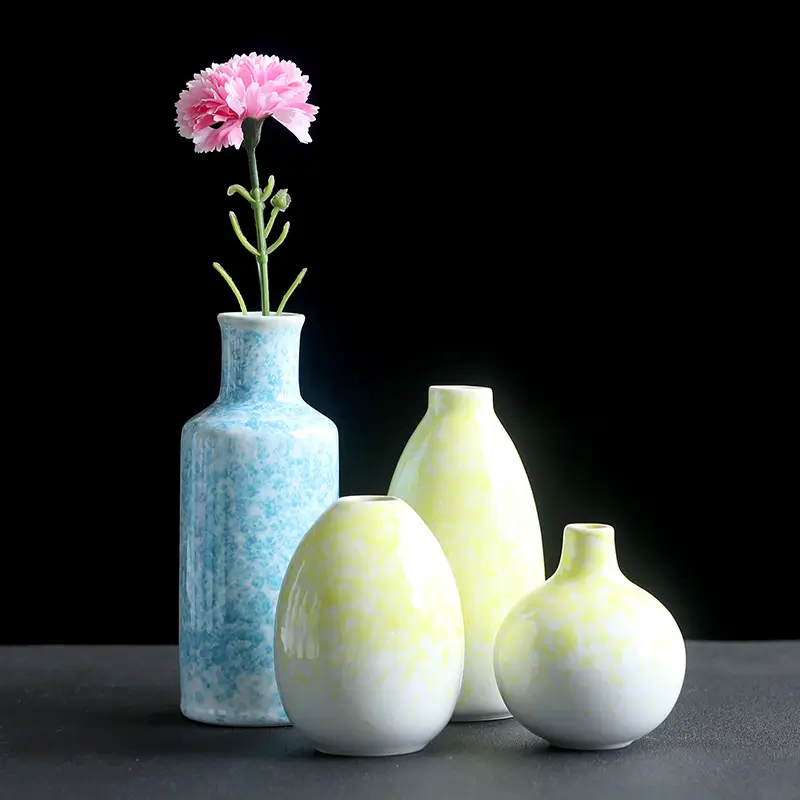 Gradient splash glaze ceramic vases displayed with flowers in different colors and sizes