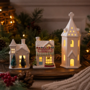 Mix-and-match light-up ceramic Christmas houses arranged together to create a layered Christmas village display