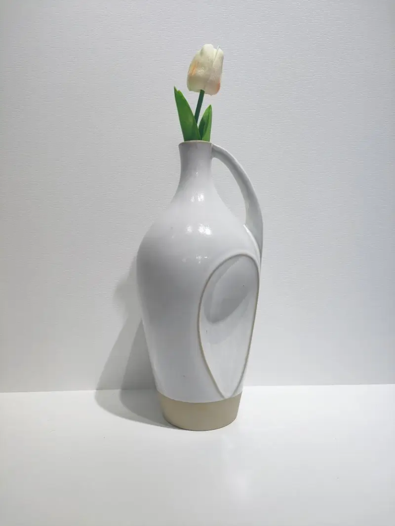011D Tall ceramic vase featuring a loop handle design and elegant elongated silhouette