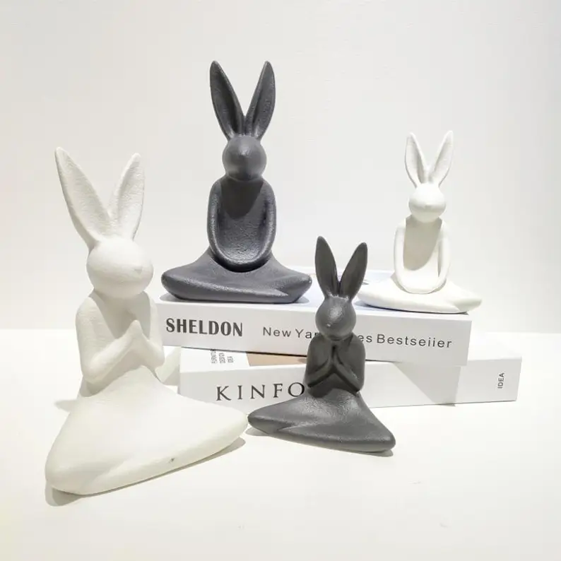 Minimalist ceramic rabbit decor with matte black and white finishes highlighting sculptural forms and modern aesthetic style